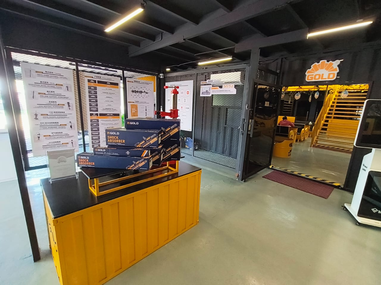 Gold Suspension showroom featuring shock absorber display and modern industrial interior